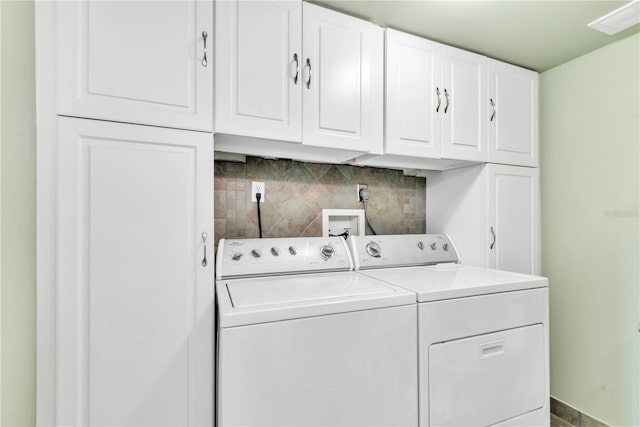 laundry area featuring cabinets and washer and dryer