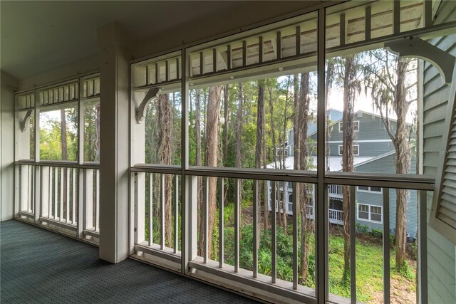 unfurnished sunroom featuring plenty of natural light