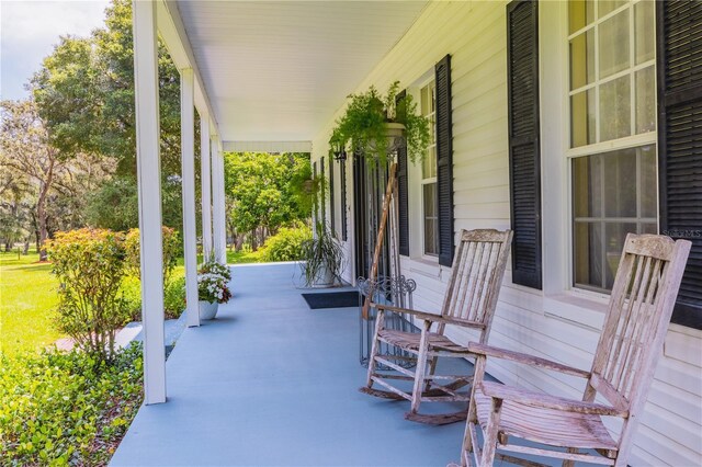 view of patio featuring a porch