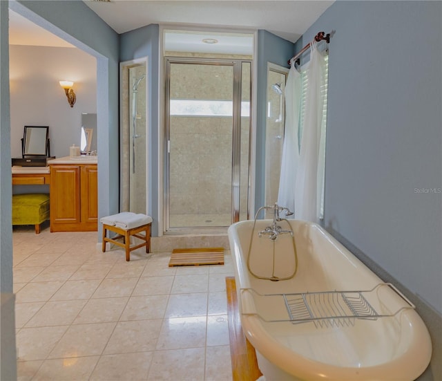 bathroom featuring independent shower and bath and tile patterned flooring