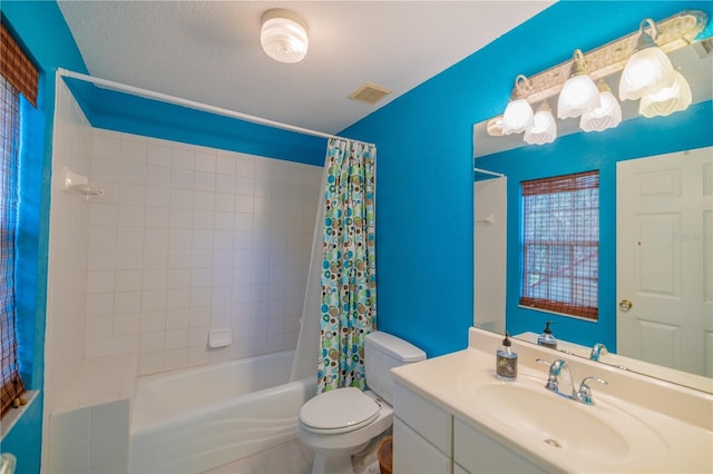 full bathroom with vanity, tile patterned floors, a textured ceiling, toilet, and shower / bath combo