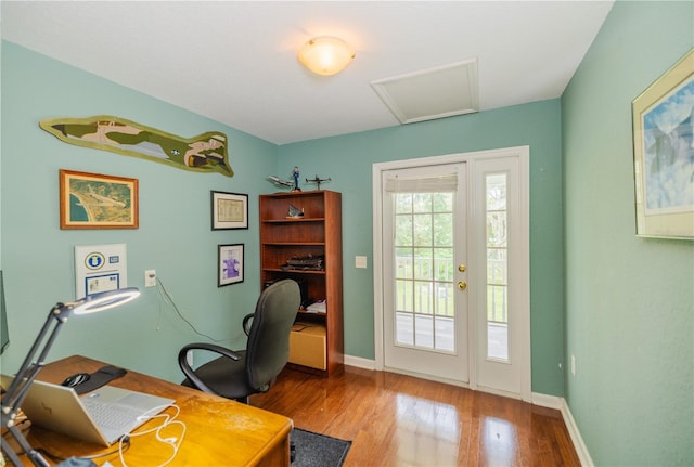 office area with hardwood / wood-style floors