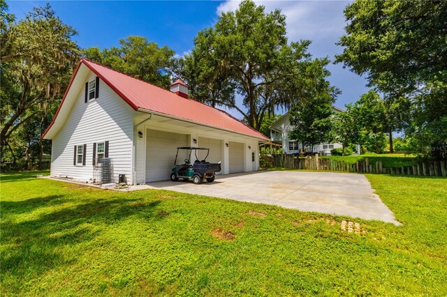 exterior space featuring a garage and an outdoor structure