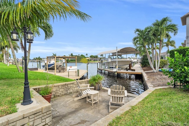 dock area with a water view and a yard