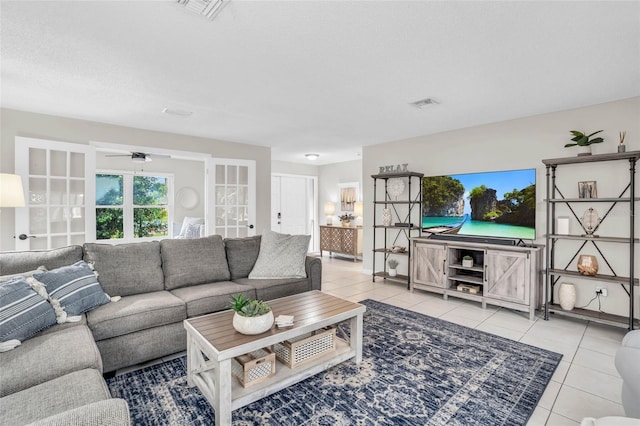 living room featuring light tile patterned floors and a textured ceiling