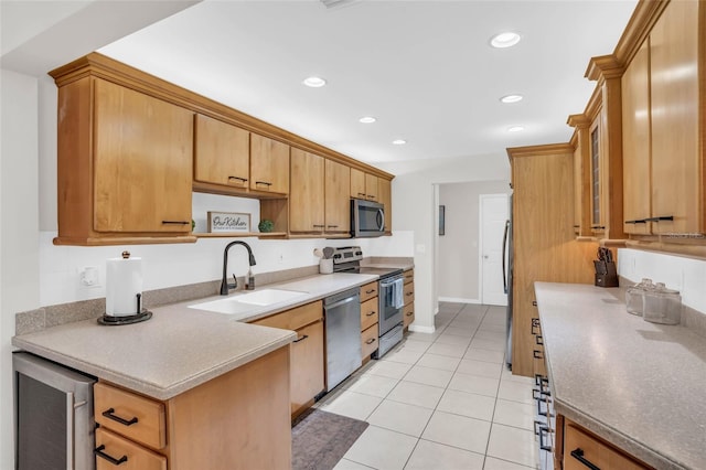 kitchen featuring wine cooler, sink, light tile patterned floors, and stainless steel appliances