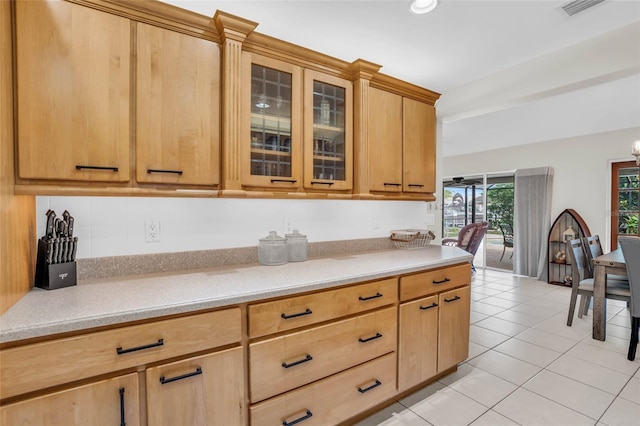 kitchen featuring light tile patterned floors and light brown cabinets