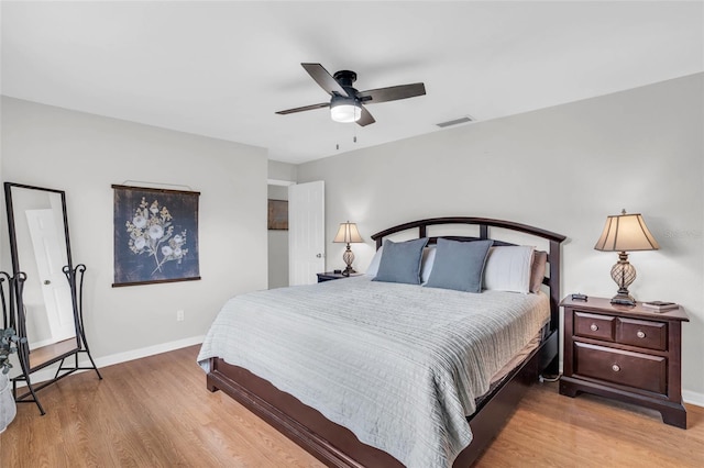 bedroom with ceiling fan and light wood-type flooring