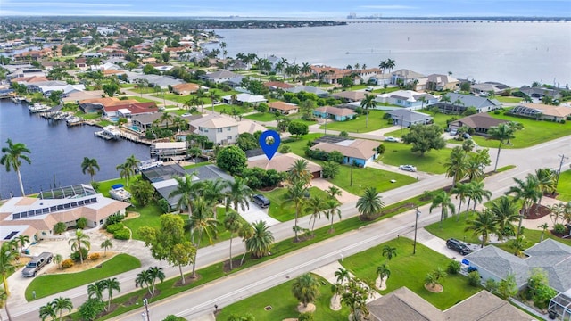 bird's eye view with a residential view and a water view