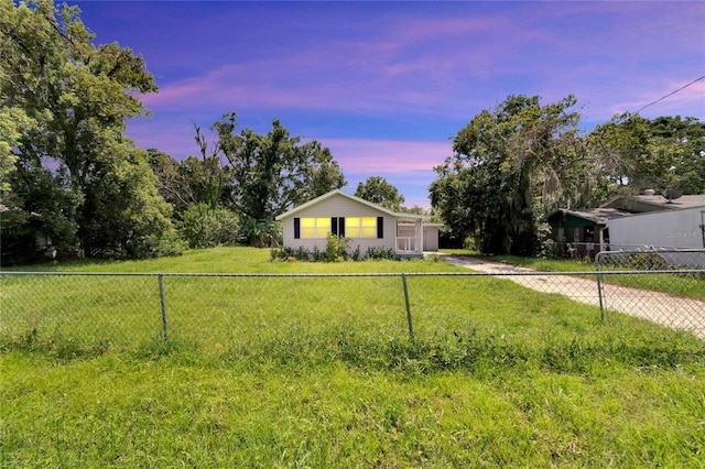 single story home featuring a yard