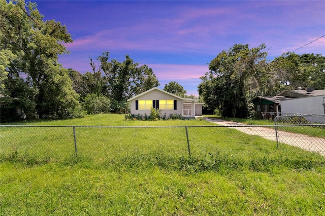 view of front facade featuring fence and driveway