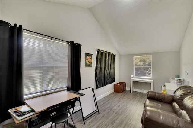 living room featuring baseboards, lofted ceiling, and light wood-style flooring
