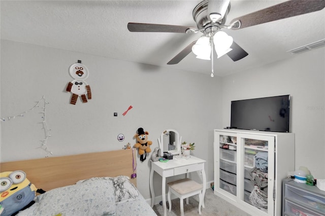 carpeted bedroom featuring visible vents and ceiling fan