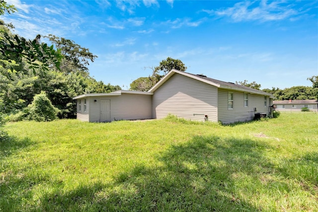 view of home's exterior with a yard