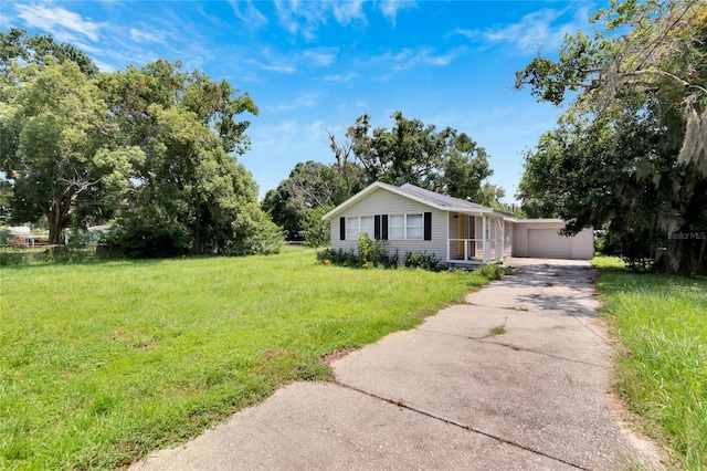 single story home with a garage and a front yard