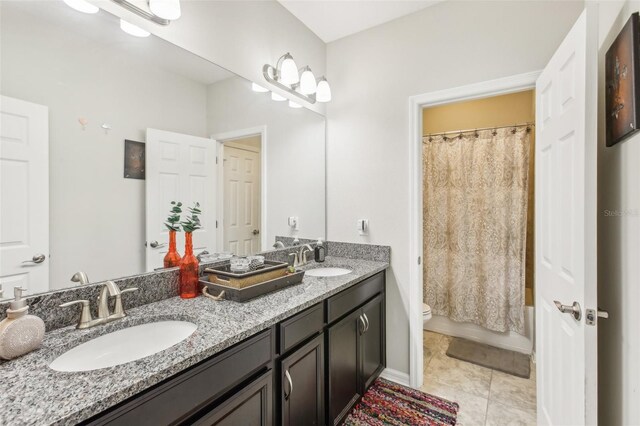 full bathroom featuring shower / tub combo with curtain, tile patterned flooring, vanity, and toilet