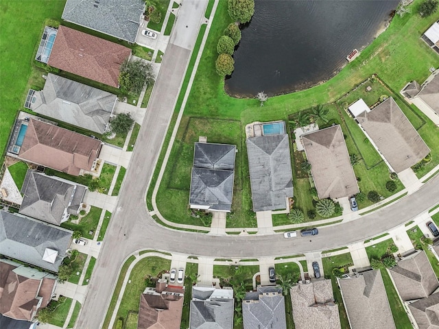 birds eye view of property featuring a residential view and a water view