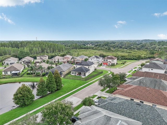 aerial view featuring a residential view and a wooded view