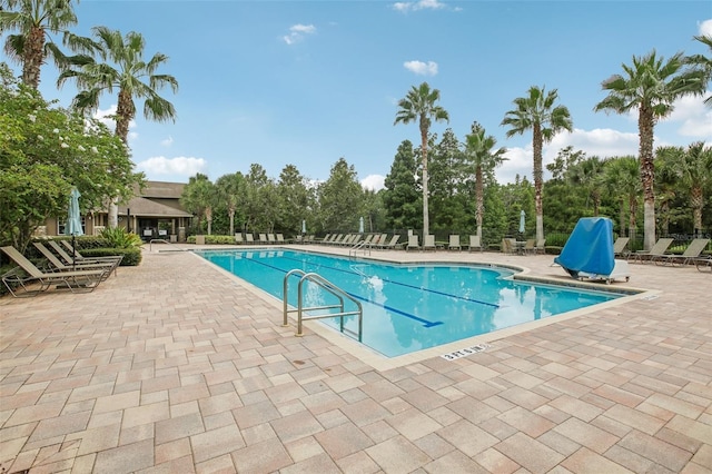 community pool with a patio area