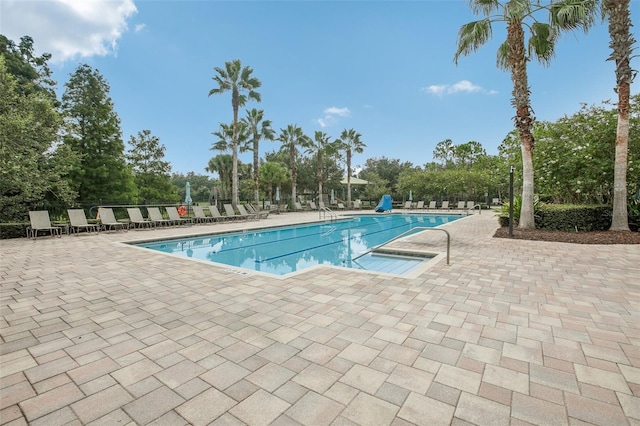 view of swimming pool featuring a patio area