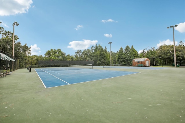 view of sport court with fence