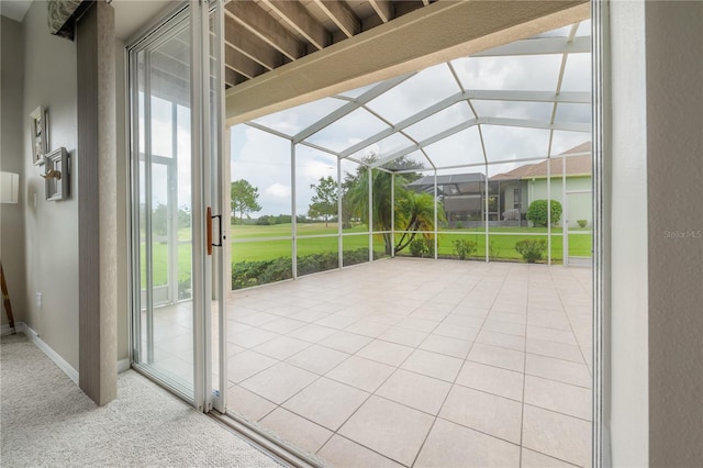 unfurnished sunroom with lofted ceiling