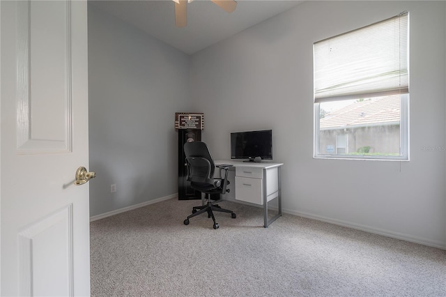 home office featuring carpet flooring, baseboards, and ceiling fan