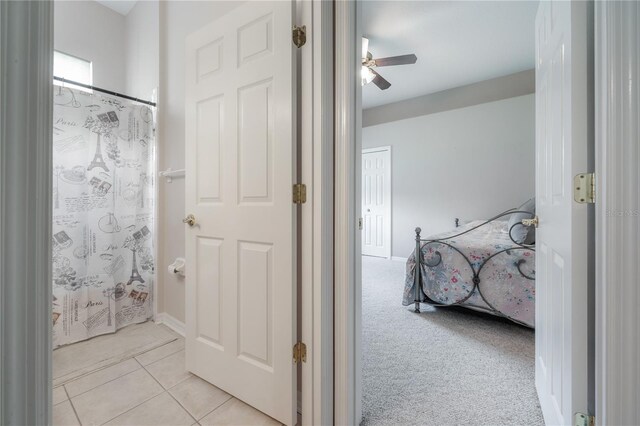 bathroom featuring tile patterned flooring and a ceiling fan