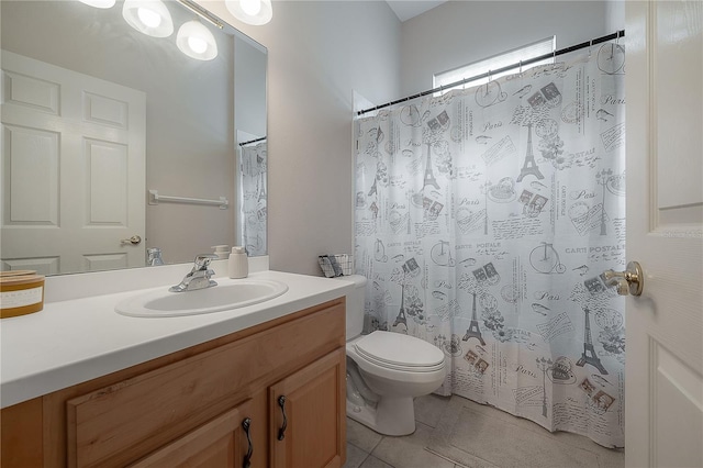 bathroom with toilet, tile patterned flooring, and vanity