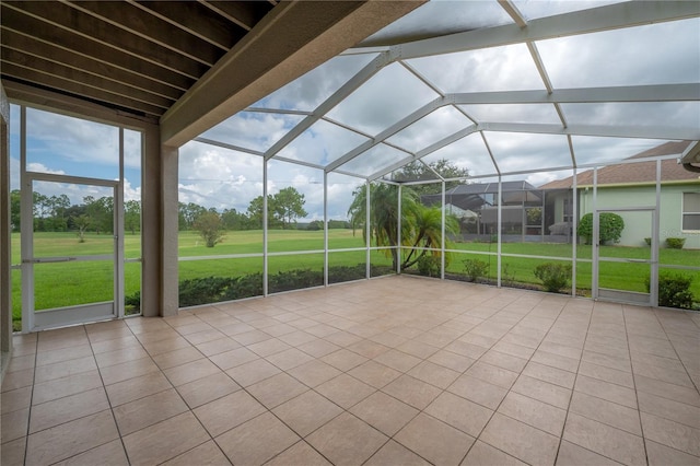 unfurnished sunroom with vaulted ceiling