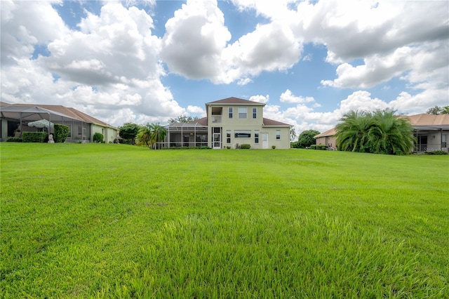 view of yard with a lanai