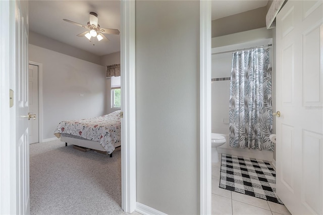 bathroom featuring ceiling fan, toilet, walk in shower, and tile patterned floors