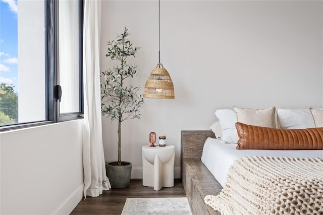 bedroom featuring dark wood-style floors and baseboards