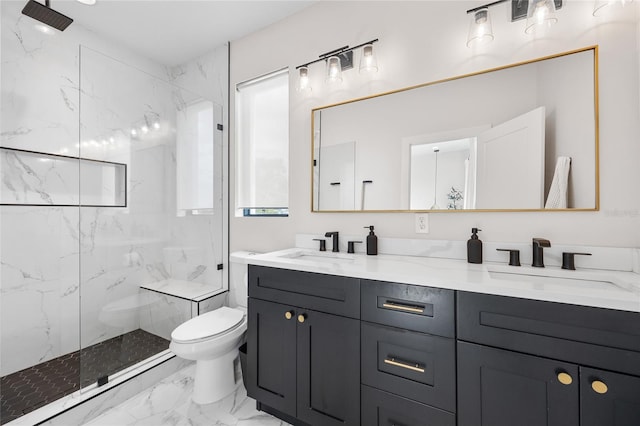 bathroom featuring marble finish floor, a sink, a marble finish shower, and toilet