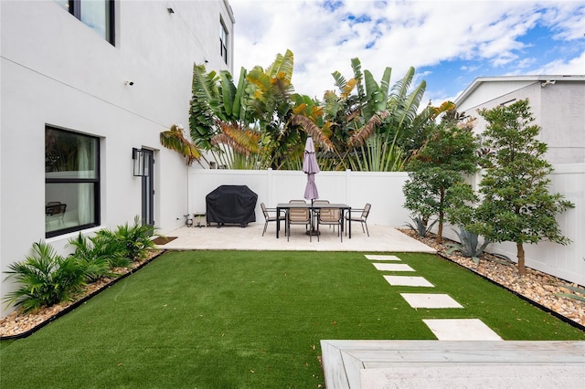 view of yard with a fenced backyard and a patio