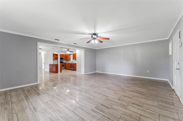 unfurnished living room featuring ceiling fan and crown molding