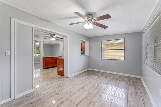 unfurnished room with ceiling fan