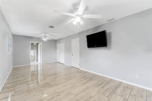 spare room with ceiling fan