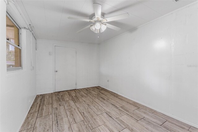 empty room featuring ceiling fan and light wood-type flooring