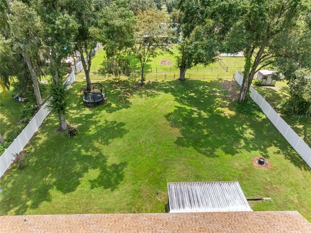 view of yard with an outdoor fire pit