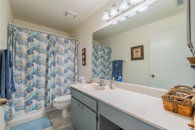 bathroom with vanity, toilet, curtained shower, and tile patterned floors