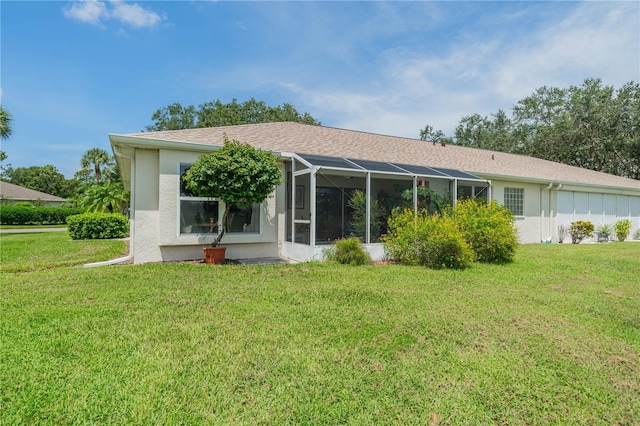 back of house with a yard