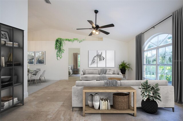 living area featuring a ceiling fan, visible vents, and vaulted ceiling