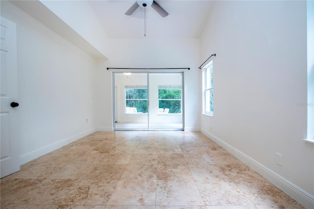 tiled empty room with ceiling fan