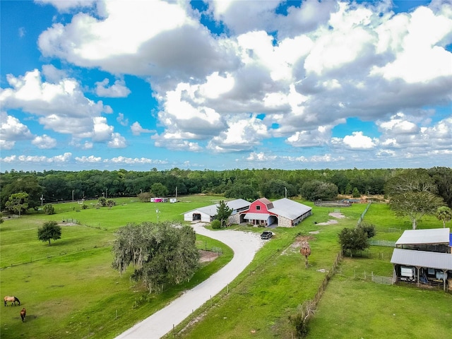 birds eye view of property with a rural view