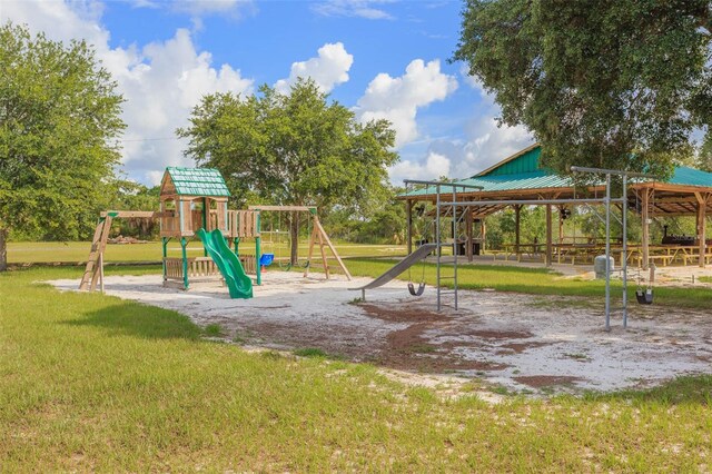 communal playground featuring a yard