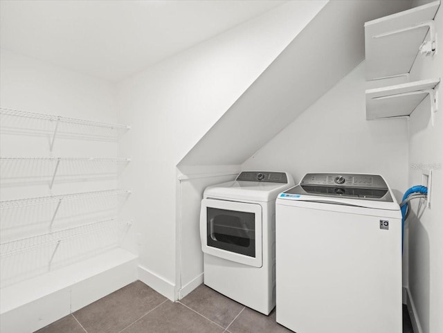 laundry room with separate washer and dryer and tile patterned floors