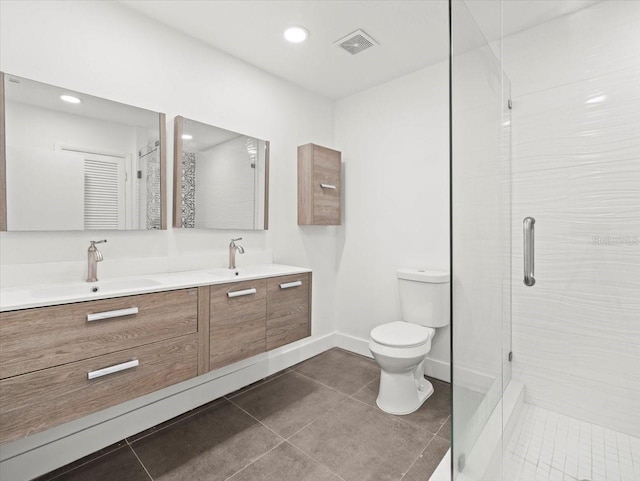 bathroom with tile patterned floors, walk in shower, toilet, and vanity