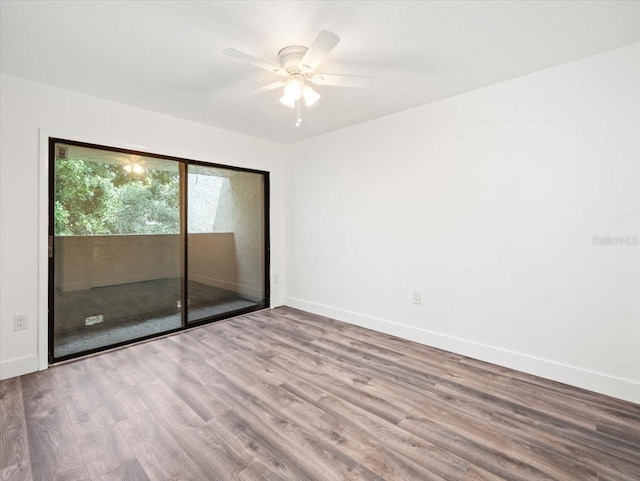 spare room featuring hardwood / wood-style flooring and ceiling fan