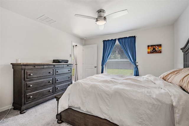 bedroom with ceiling fan and light carpet